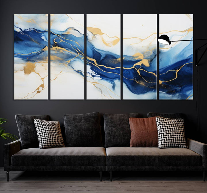 The Blue Abstract Wall Art is displayed as a triptych on museum-quality canvas, showcasing a blue and gold abstract design. The artwork includes a UV-protective coating to maintain its vibrancy and comes with the benefit of free shipping.