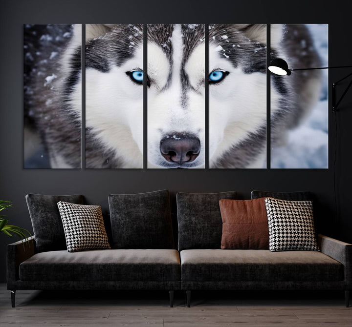 A large framed Winter Siberian Husky Wolf Wall Art Canvas Print, an exquisite piece of animal portrait decor, hangs prominently on the wall.