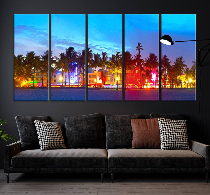 The living room features a three-panel Miami City Wall Art Canvas Print, showcasing a colorful, illuminated beach scene with palm trees on museum-quality canvas.