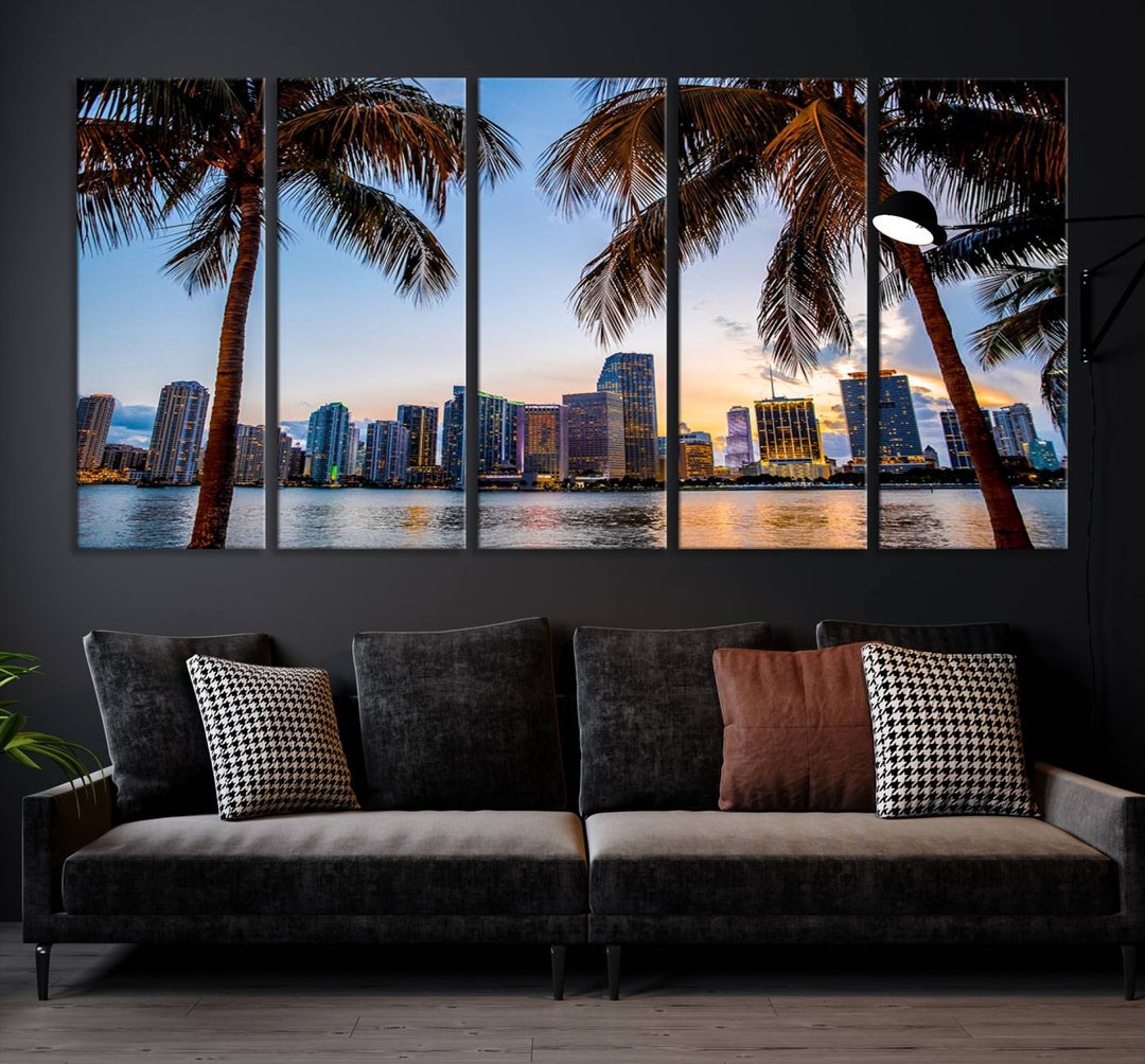 The Wall Art MIAMI Canvas Print features a triptych design depicting palm trees and a city skyline at sunset.