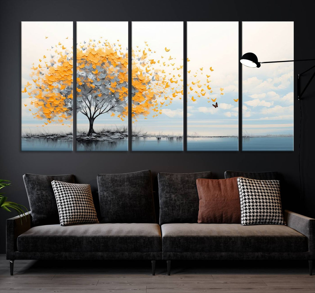 Abstract tree with yellow butterflies canvas wall art in a modern living room setting.