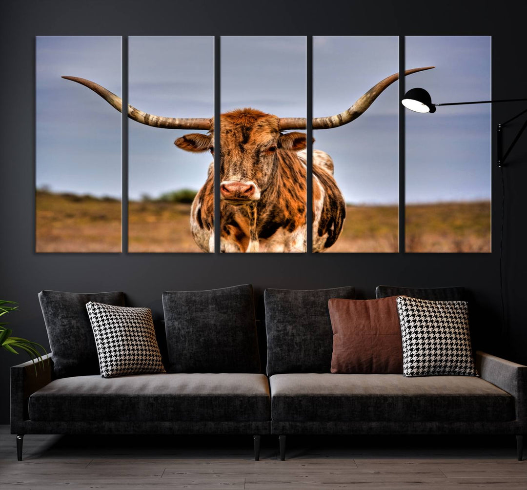 The Texas Longhorn Wall Art Print, a triptych canvas artwork depicting a longhorn bull in a field, features a gallery-quality finish.