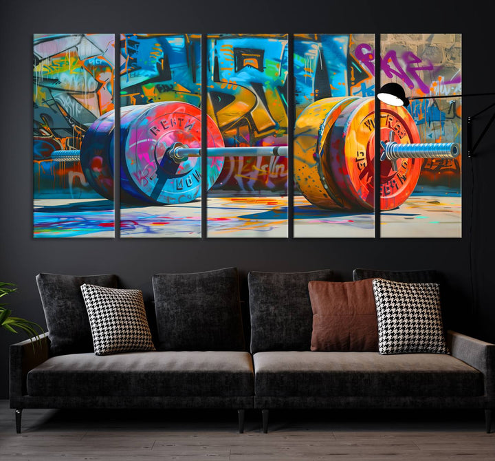 The Fitness Gym Barbell Graffiti Wall Art Canvas Print, a vibrant triptych featuring a barbell against a graffiti backdrop, elegantly hangs in the room. Crafted on premium canvas with a gallery-quality finish, this stunning piece of wall art effortlessly combines urban flair with sophisticated decor.