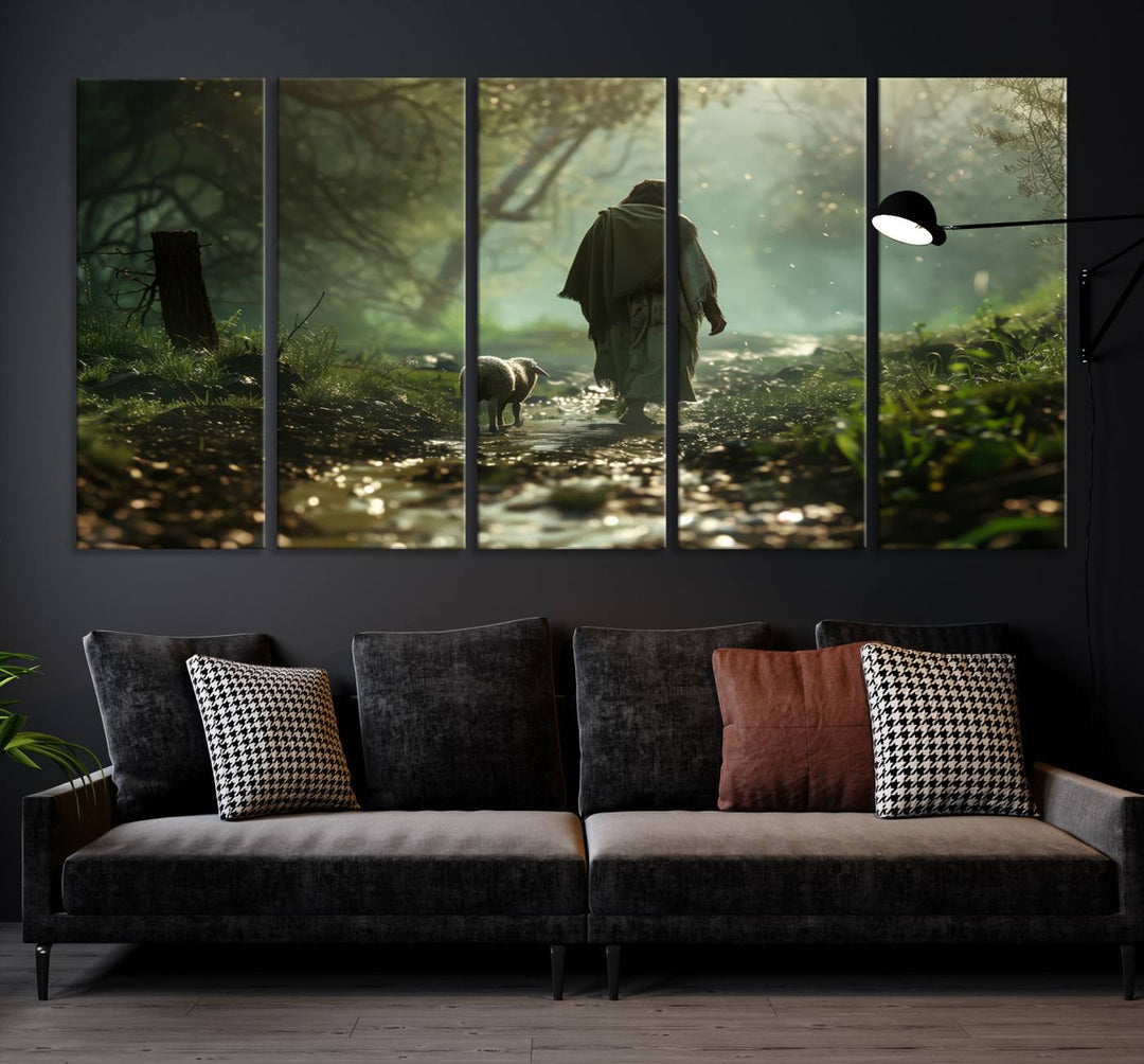 The wall art piece, titled "Jesus Shepherd a Lost Lamb Canvas Wall Art Print," is suspended on the wall and depicts a robed figure and a lamb wandering along a forest path.