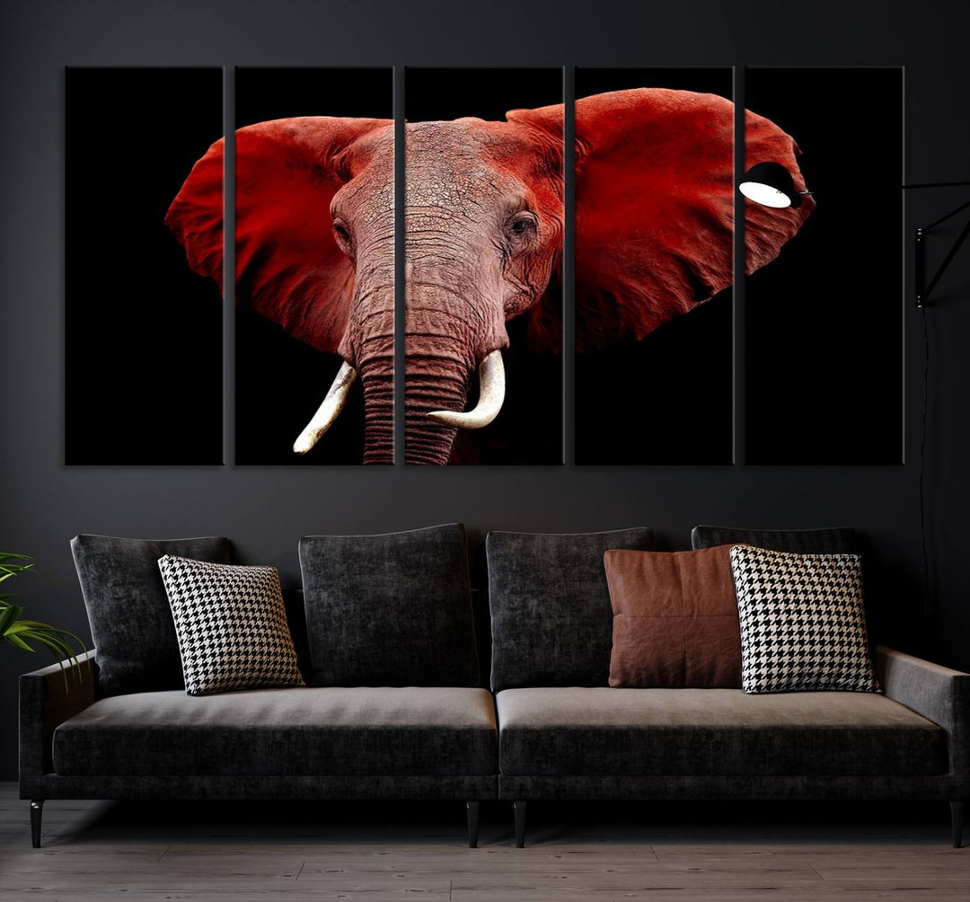 A Wall Art Canvas Print in the modern living room features a three-panel premium design of a red elephant face.