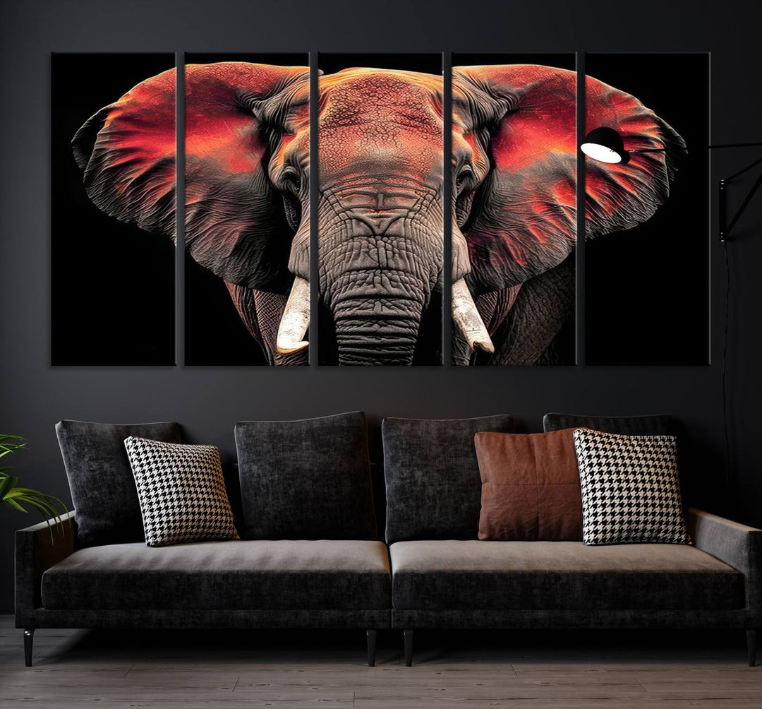 The Elephant Wall Art Canvas Print, featuring vibrant red and black tones, is a stunning artwork printed on museum-quality canvas. It comes with a UV-protective coating.