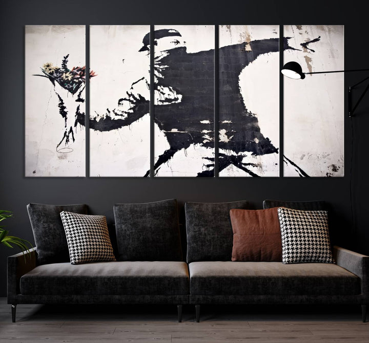 The living room features a split-panel art piece named "Banksy Flower Throw Graffiti Street Wall Art Canvas Print," gallery wrapped on museum-quality polycotton canvas and accentuated by modern decor elements.