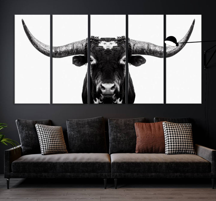 The living room is adorned with the Texas Cow Longhorn Wall Art Canvas Print in Black and White—framed and ready to hang.