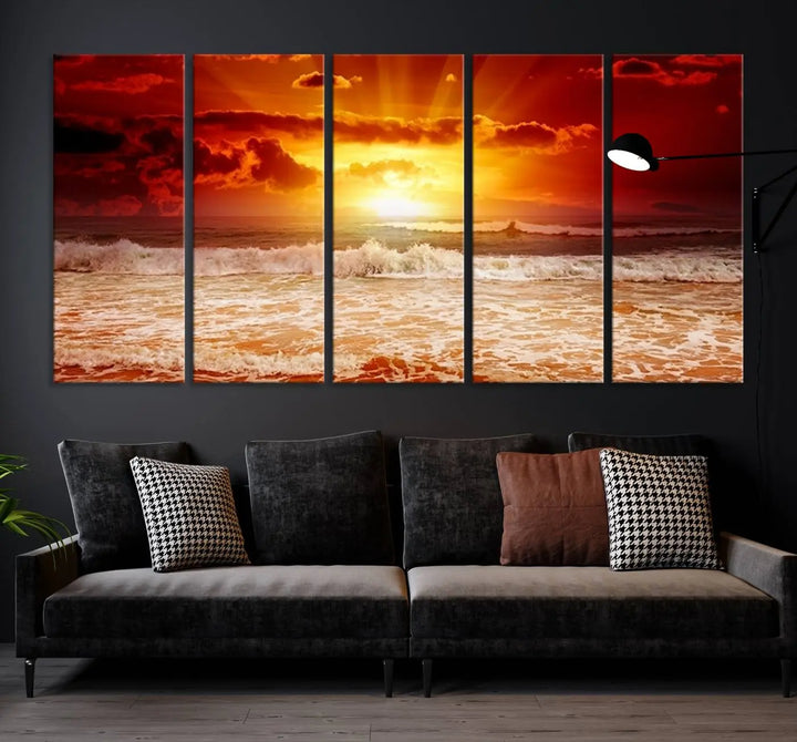 In a modern living room, the vibrant "Wall Art Canvas Perfect Sunset Turns Colour of Sea and Sky to Red," printed on museum-quality canvas, stands out. A floor lamp casts warm light over the ready-to-hang artwork, which includes a UV-protective coating to ensure lasting brilliance.