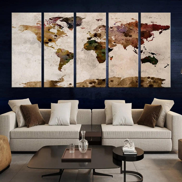 A Watercolor World Map Canvas Print, wrapped in an elegant gallery style, hangs on the wall.