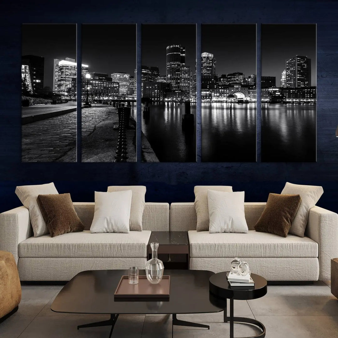 The Boston City Lights Skyline Black and White Wall Art Cityscape Canvas Print portrays a triptych of the city skyline at night reflecting on a calm river. This museum-quality canvas features UV-protective finishes to preserve its timeless allure.