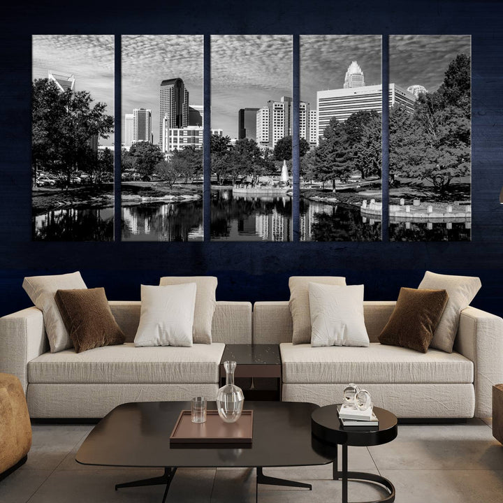 The living room features a captivating triptych titled "Charlotte City Cloudy Skyline Black and White Wall Art Cityscape Canvas Print," crafted on museum-quality canvas with UV-protective coating. Modern decor accentuates the dynamic scene.