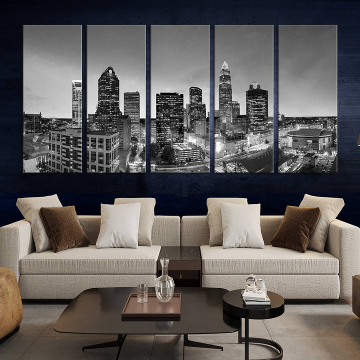 The "Charlotte City Cloudy Skyline Black and White Wall Art Cityscape Canvas Print" hangs on a dark wall, showcasing its UV-protective properties for enduring beauty.