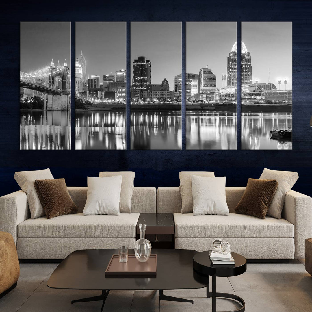 The "Cincinnati City Lights Skyline Black and White Wall Art Cityscape Canvas Print" is elegantly displayed in a stylish living room.