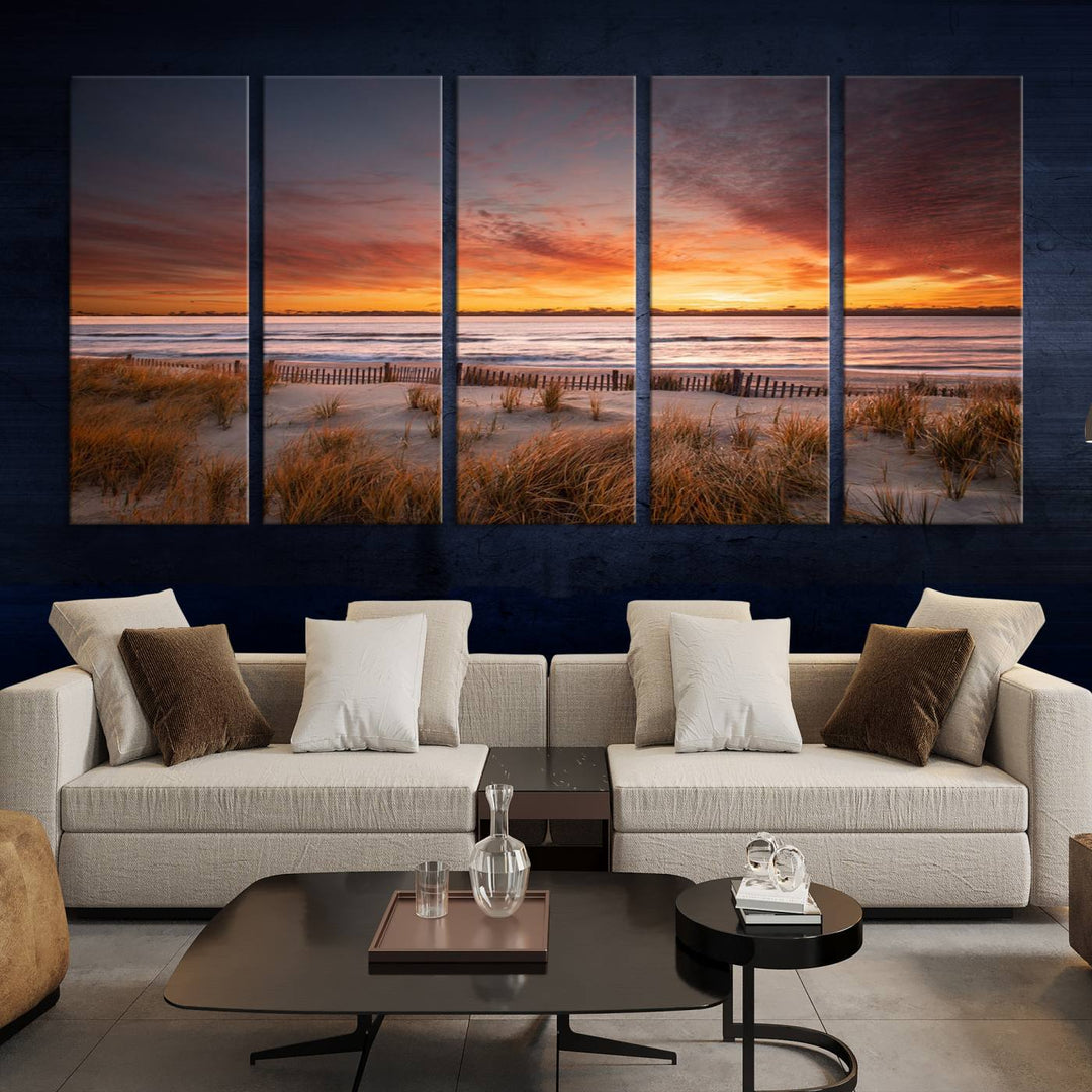 Sunset on The Beach Wall Art Canvas Print features a triptych of a beach at sunset with vivid orange skies, presented on museum-quality canvas. Each section is gallery wrapped, offering lasting beauty with its UV-protective coating.