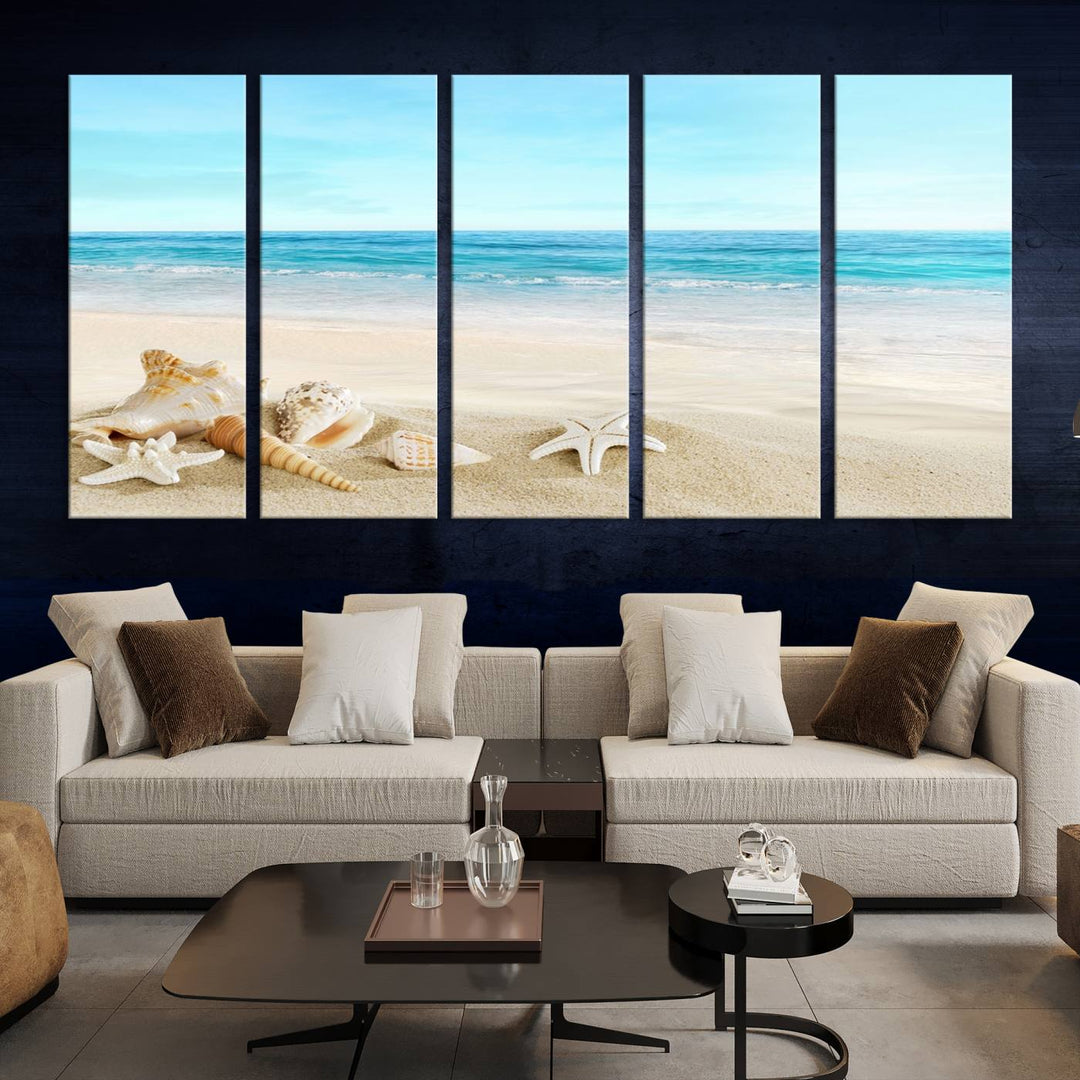 The "Turquoise Ocean View Seashell Starfish on the Beach Canvas Print Artwork" is a triptych piece that showcases a tranquil beach scene, complete with seashells and starfish adorning the sand. It is elegantly gallery-wrapped on museum-quality canvas.