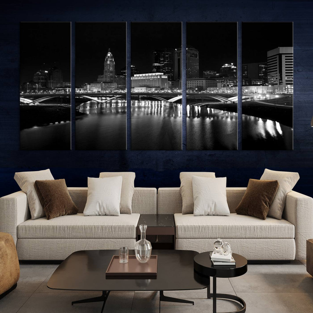 The living room features the "Columbus City Lights Skyline Black and White Wall Art Cityscape Canvas Print" above a coffee table. This artwork is presented as a triptych on museum-quality canvases with UV-protective coating.