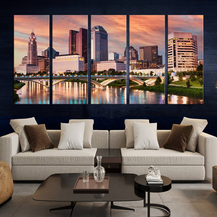 The "Columbus City Lights Sunset Orange Cloudy Skyline Cityscape View" wall art is featured on the wall. This triptych is printed on museum-quality canvas and includes a UV-protective coating, ensuring lasting vibrancy.