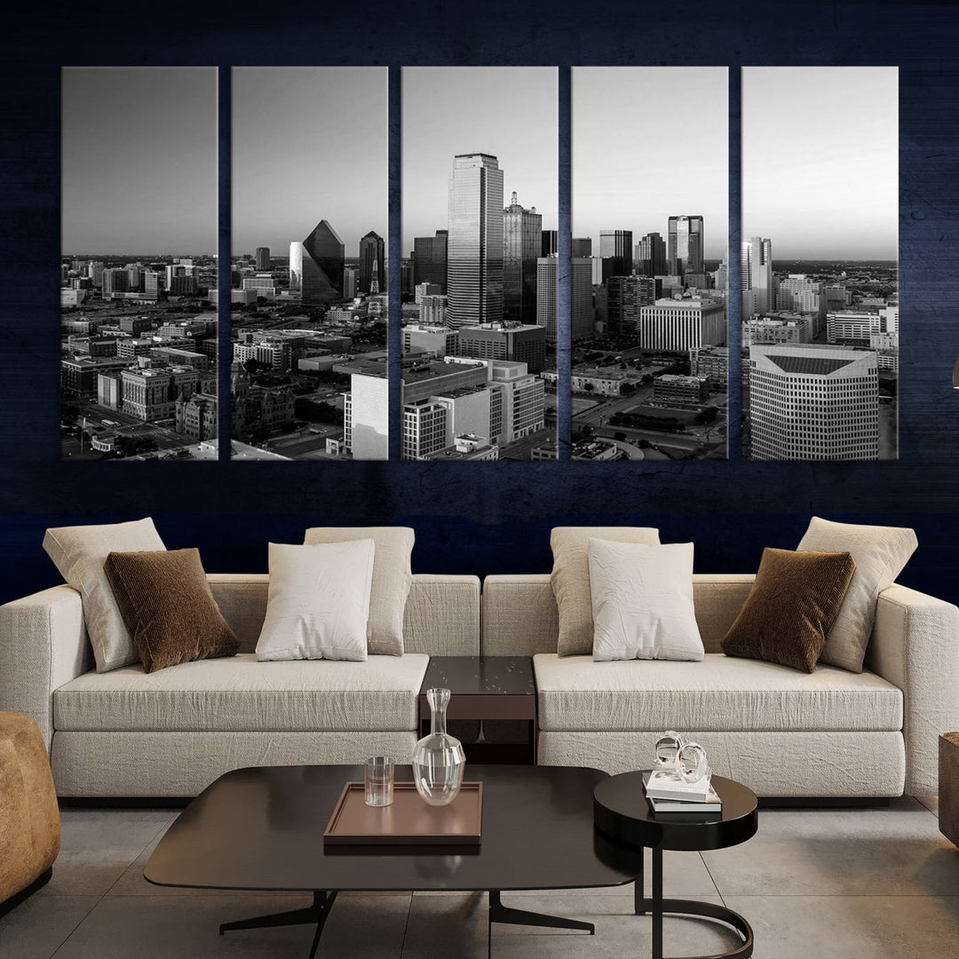 A modern living room showcases the Dallas City Lights Skyline Black and White Wall Art Cityscape Canvas Print. This gallery-wrapped piece offers a sleek finish and is crafted from museum-quality pollycotton. It features a UV-protective coating to ensure lasting vibrancy.