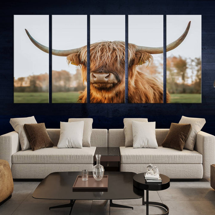 A Highland Cow Animal Scottish Cattle Art Print Farmhouse Wall Art Canvas Print hangs in the living room, adding a touch of rustic farmhouse decor.