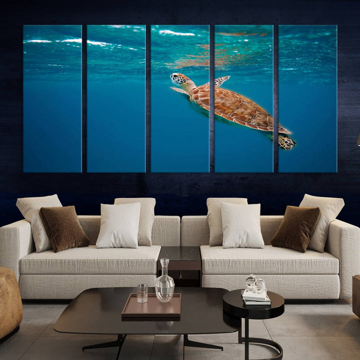 The living room features the "Baby Turtle in Ocean" wall art canvas print. This gallery-quality piece, depicting a sea turtle swimming underwater, adds an elegant touch to the space.