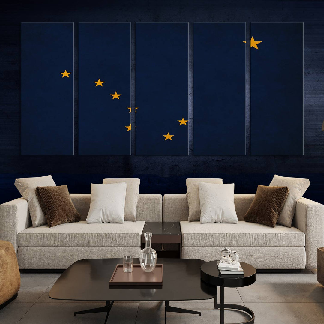 A contemporary living room featuring a triptych artwork of stars on a navy background, accentuated by the striking Alaska States Flag Wall Art Canvas Print.