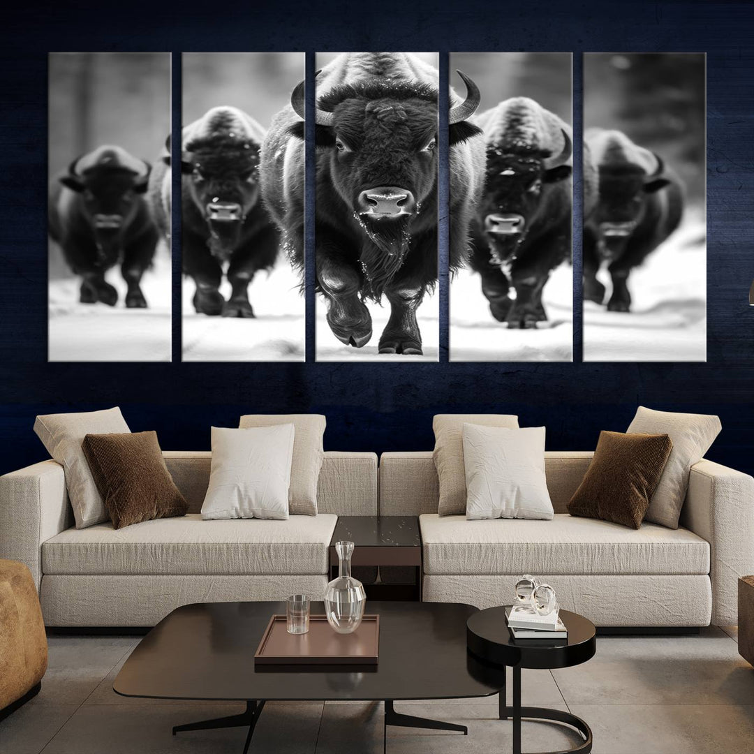 A modern living room features a striking black-and-white American Bison Art | Buffalo Herd Wall Art Canvas Print on the wall.