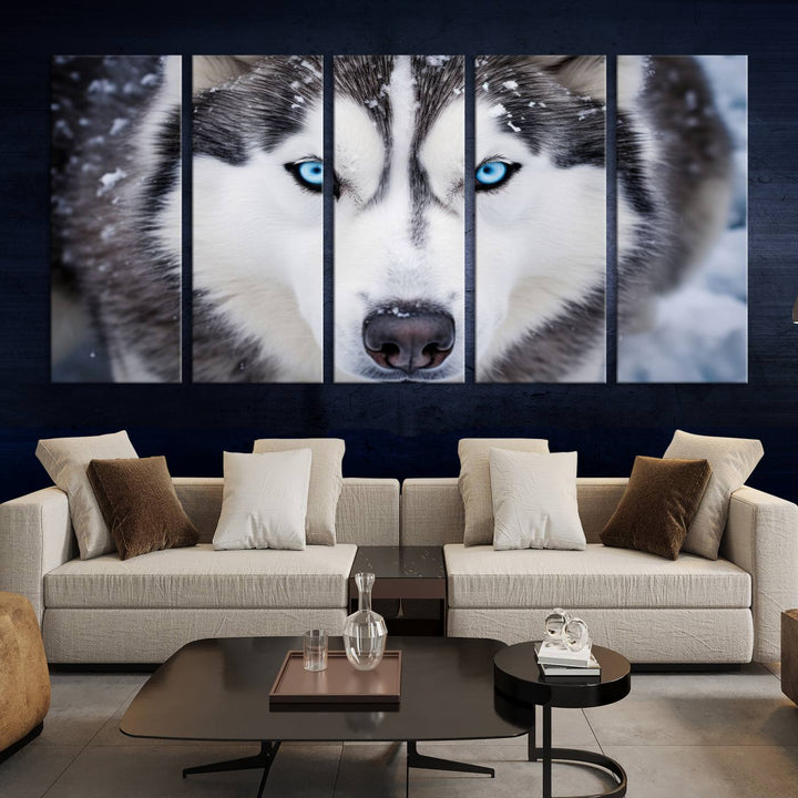 A large framed Winter Siberian Husky Wolf Wall Art Canvas Print, an exquisite piece of animal portrait decor, hangs prominently on the wall.