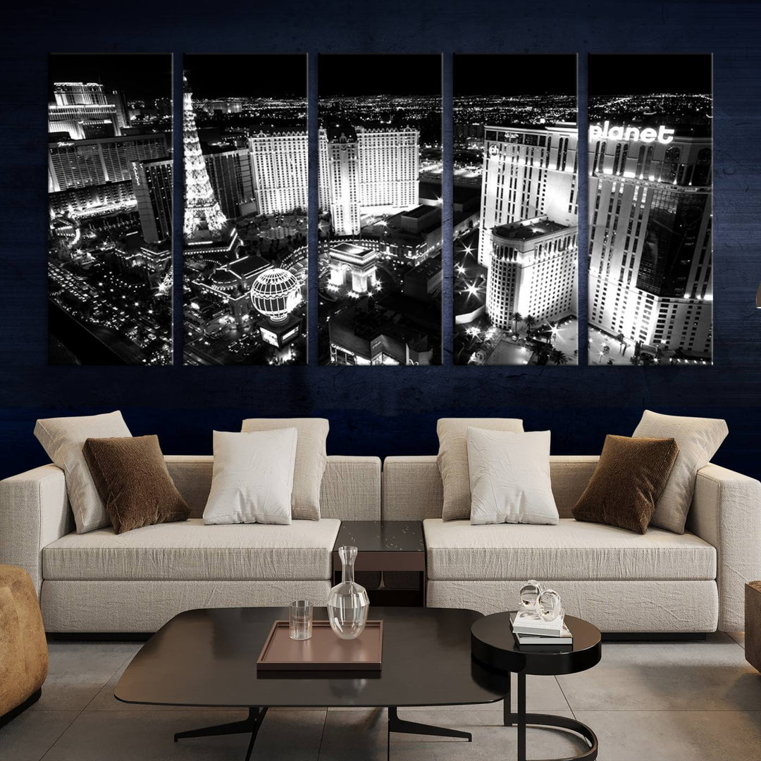 The Las Vegas Wall Art Canvas Print is a black and white triptych that showcases a city skyline at night. Crafted on museum-quality canvas with a UV-protective coating, it serves as an elegant and ready-to-hang focal point in the room.