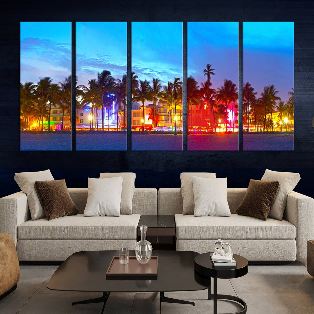 The living room features a three-panel Miami City Wall Art Canvas Print, showcasing a colorful, illuminated beach scene with palm trees on museum-quality canvas.