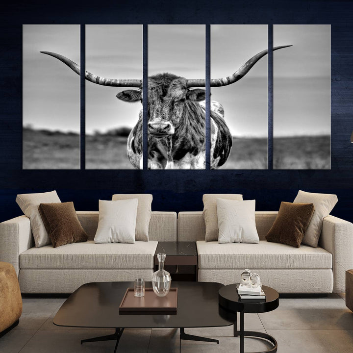 The Texas Longhorn Cow Wall Art, featuring a black and white image of a longhorn bull on canvas, brings charm to the room with its sophisticated appeal.