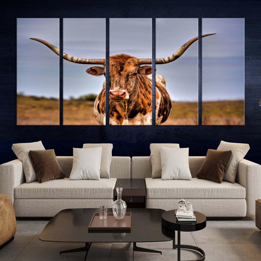 The Texas Longhorn Wall Art Print, a triptych canvas artwork depicting a longhorn bull in a field, features a gallery-quality finish.