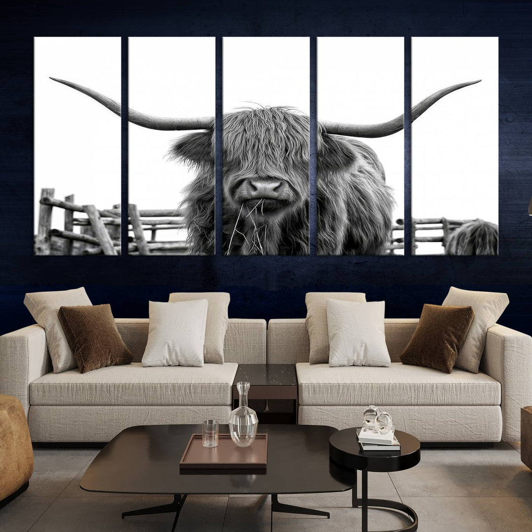 The Longhorn Canvas Print, featuring a black-and-white triptych of a Bighorn cow with shaggy fur and impressive long horns, is elegantly showcased. This wall art piece boasts a gallery-quality finish on premium canvas, bringing sophistication to any room.