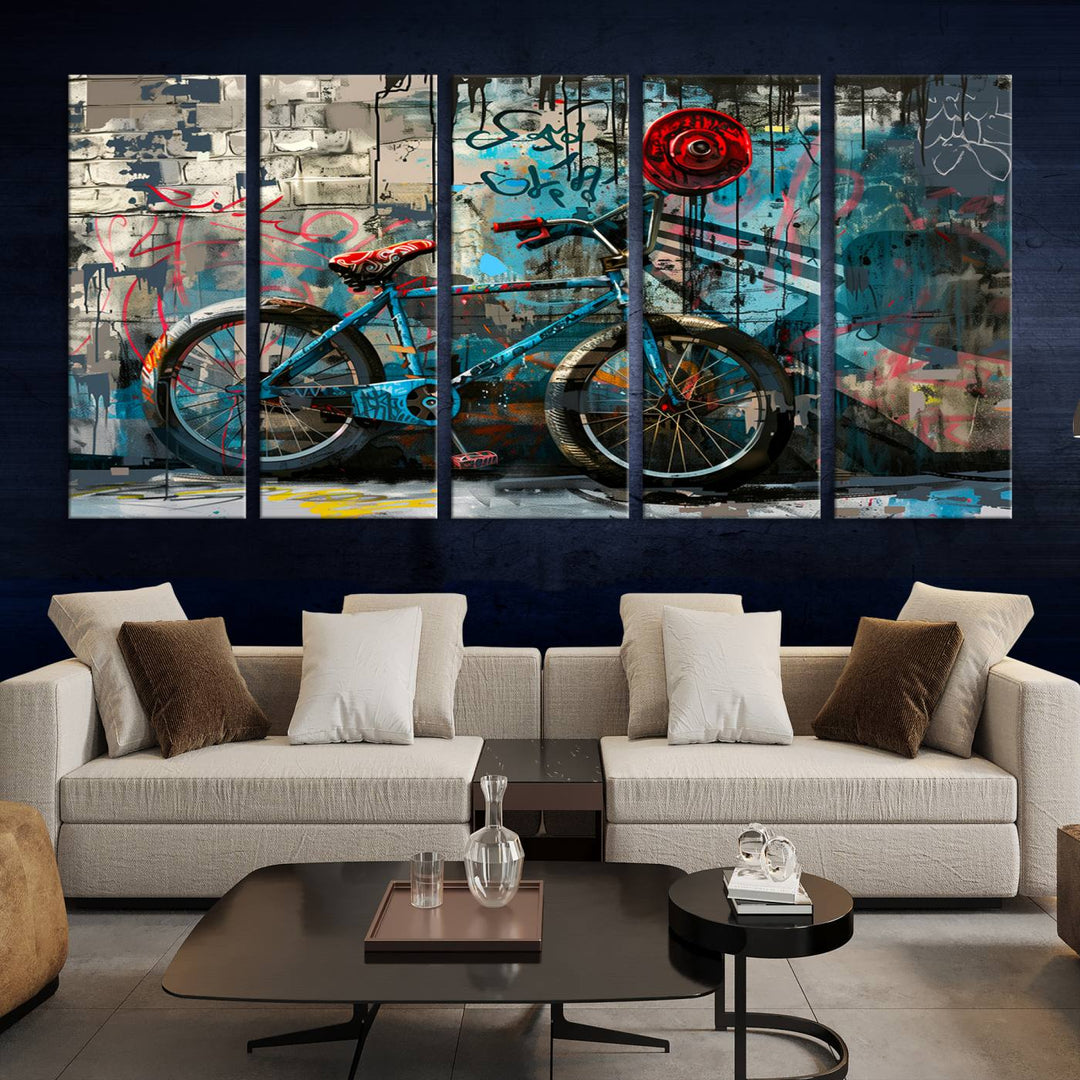 A modern living room features a triptych wall art of an abstract bicycle, designed in a graffiti style on a brick wall. This piece is expertly crafted on the Abstract Bicycle Wall Art Canvas Print, offering a premium canvas that ensures a gallery-quality finish.