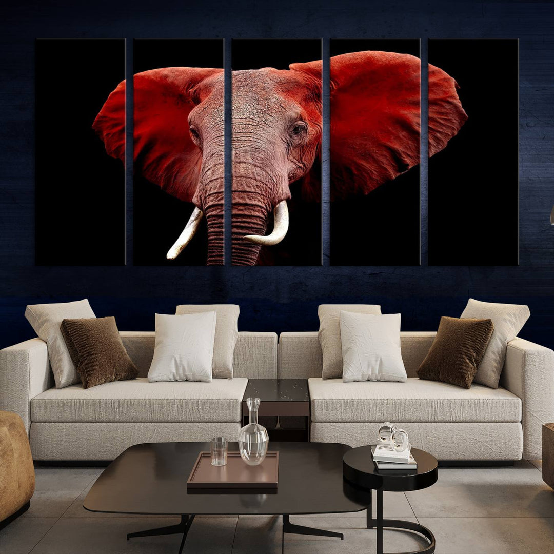 A Wall Art Canvas Print in the modern living room features a three-panel premium design of a red elephant face.