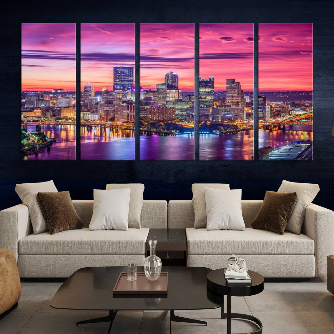 The Pittsburg Wall Art Canvas Print, showcasing a vibrant sunset glow over the city skyline and crafted by a professional artisan, adorns the space.