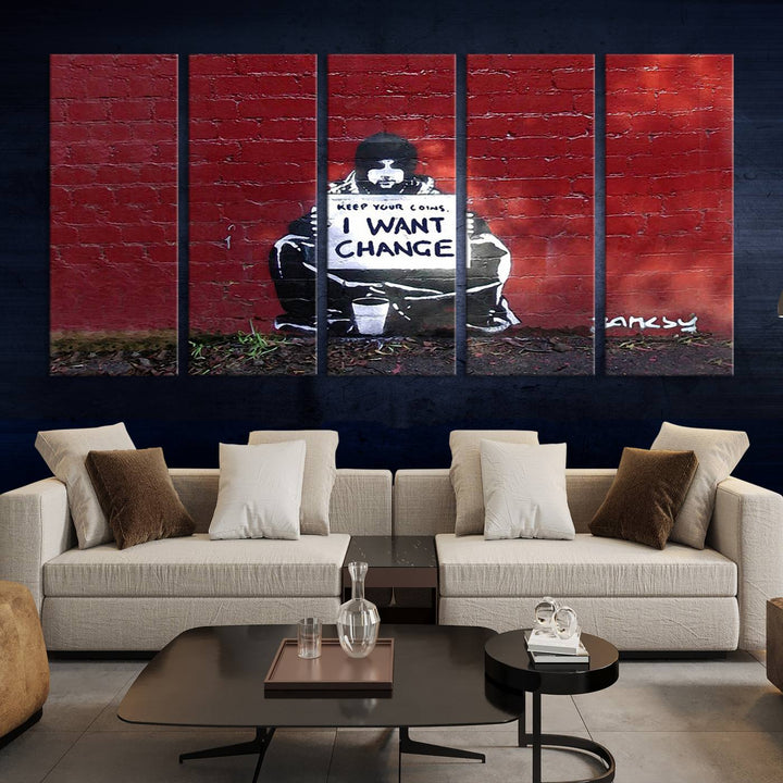 The living room showcases a triptych of stencil artwork on museum-quality canvas, featuring the Banksy I Want Change Graffiti Abstract Wall Art Canvas Print. This captivating piece depicts a person holding a sign that says "I want change" and is finished with a UV-protective coating to ensure long-lasting beauty.