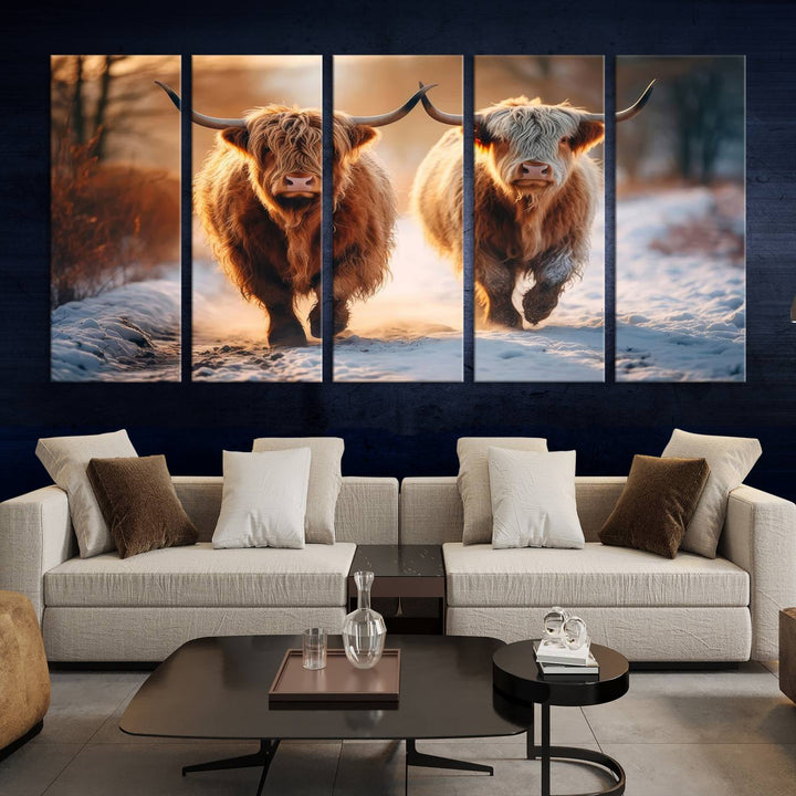 The living room showcases a triptych from the Scottish Highland Cow Horn Farm Wall Art Canvas Print collection, depicting two Highland cows running in the snow. Complementing this are handmade wall art pieces with a gallery-quality finish that add an elegant touch.