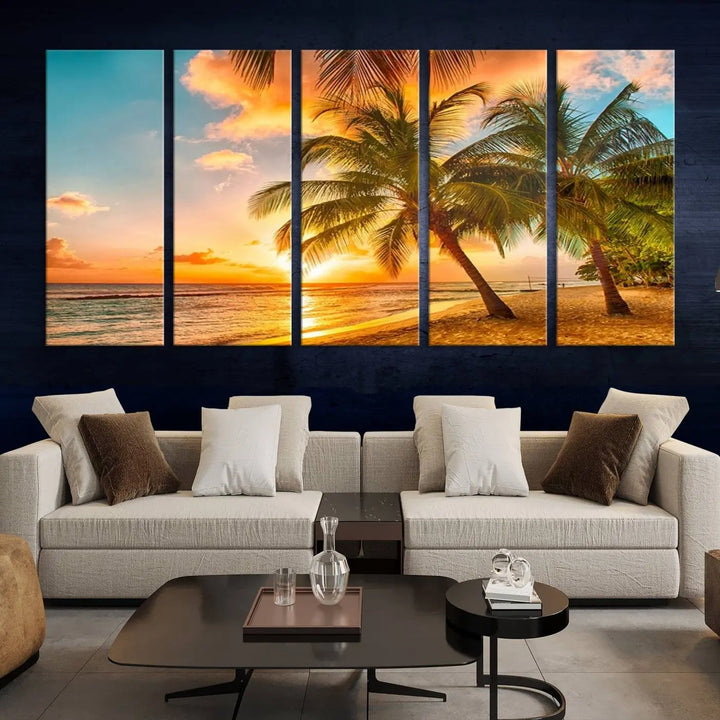 The Tropical Sunset Wall Art Print features a vibrant beach scene with palm trees and an ocean view highlighted by a golden sunset.