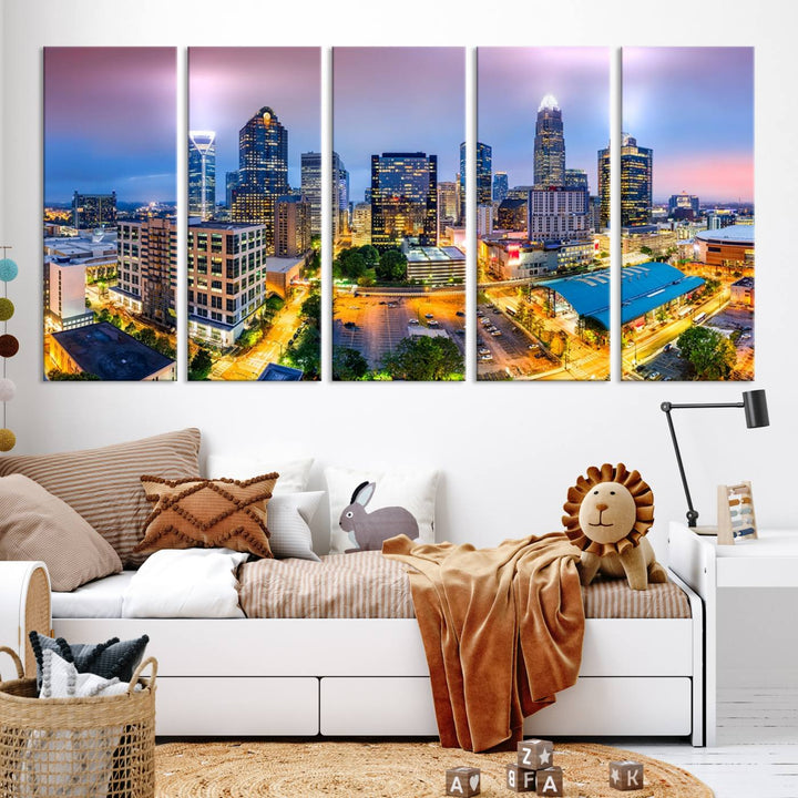 The living room features three large pieces of the *Charlotte City Lights Sunset Purple Skyline Cityscape View Wall Art Canvas Print*. Crafted on gallery-wrapped, museum-quality canvas with UV-protective coating, they grace the wall and add an artistic flair to the space.