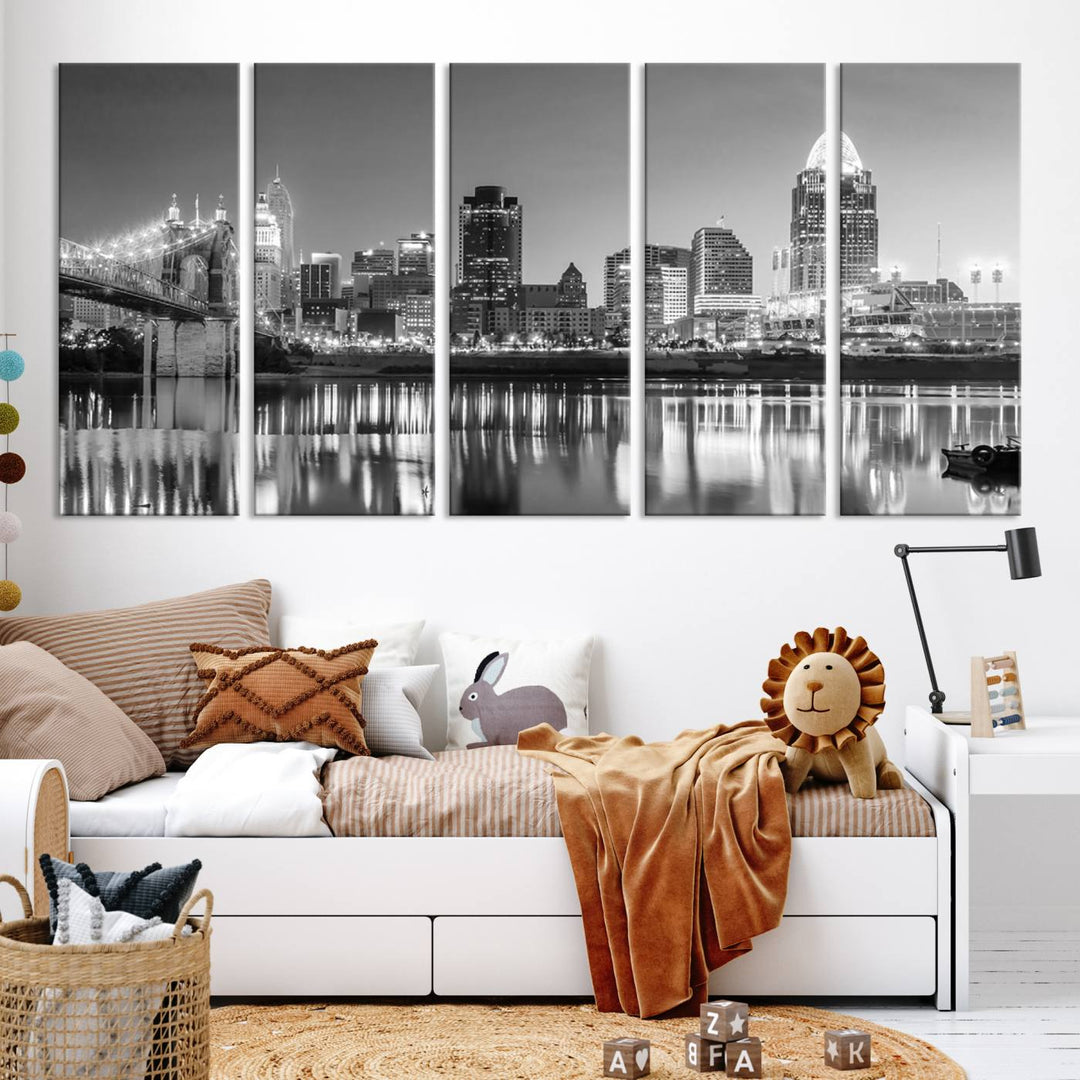 The "Cincinnati City Lights Skyline Black and White Wall Art Cityscape Canvas Print" is elegantly displayed in a stylish living room.