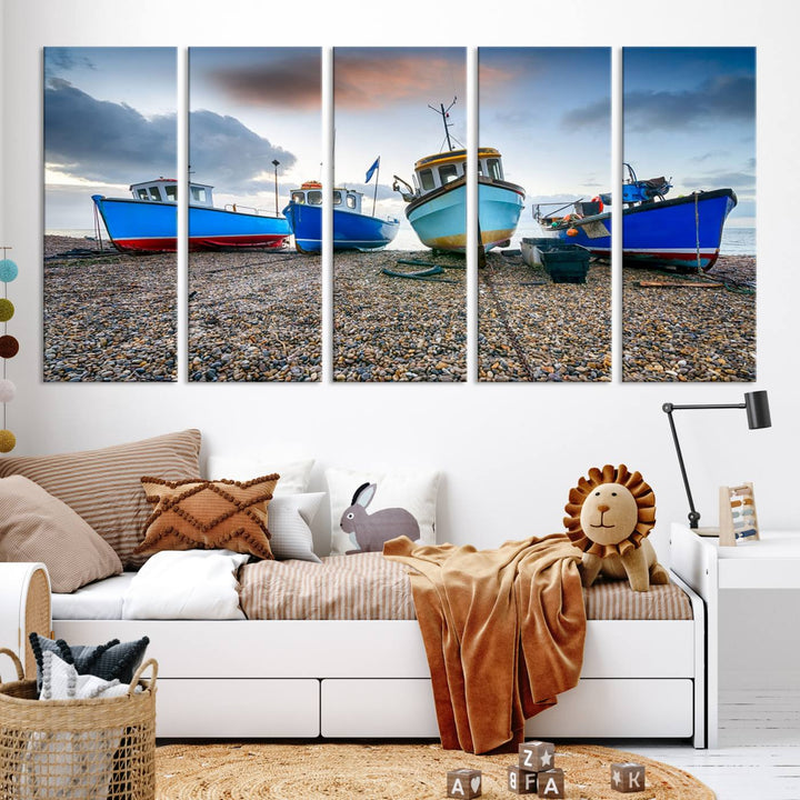 The "Big Boats On The Beach Wall Art Canvas Print" is a stunning piece featuring three museum-quality panels depicting fishing boats on a pebbled shore. Ready to hang and featuring UV-protective coating, it serves as an elegant addition to your home décor.