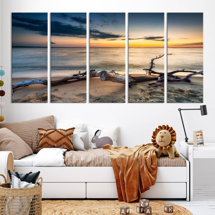 A captivating piece of Ocean Sunset Beach Wall Art Canvas Print, gallery wrapped, graces the gray wall.