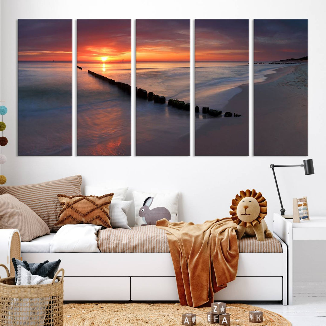 In a modern living room, the Sunset Beach Wall Art Canvas Print is displayed above. This triptych, printed on museum-quality canvas with a UV-protective coating, ensures lasting brilliance. It's ready to hang and brings an elegant touch to your space.