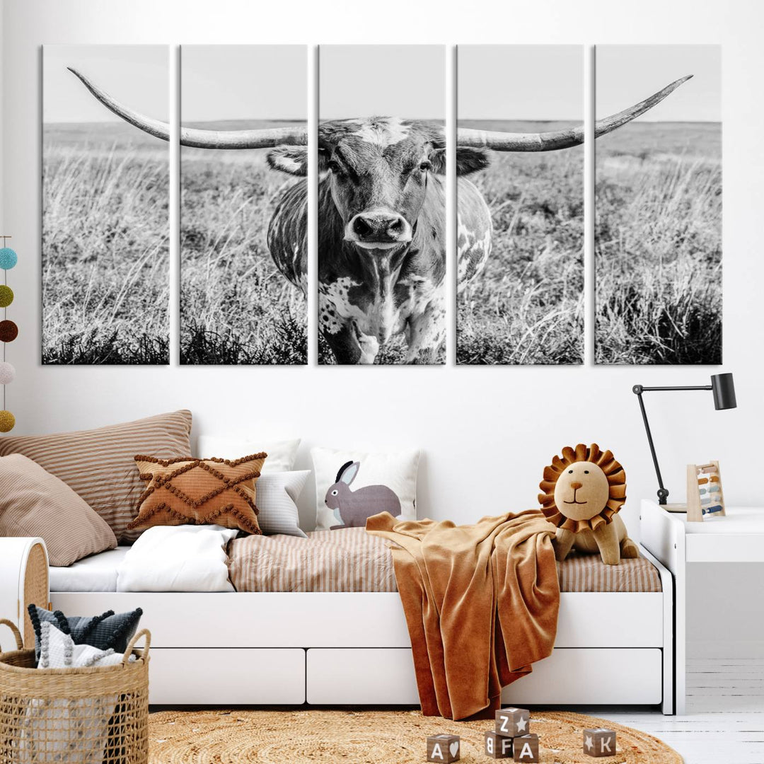 The Texas Cow Longhorn Wall Art Canvas Print is a black and white triptych depicting a cow in a field. It is crafted with museum-quality canvas and features a UV-protective coating.