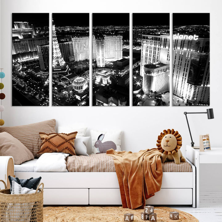 The Las Vegas Wall Art Canvas Print is a black and white triptych that showcases a city skyline at night. Crafted on museum-quality canvas with a UV-protective coating, it serves as an elegant and ready-to-hang focal point in the room.