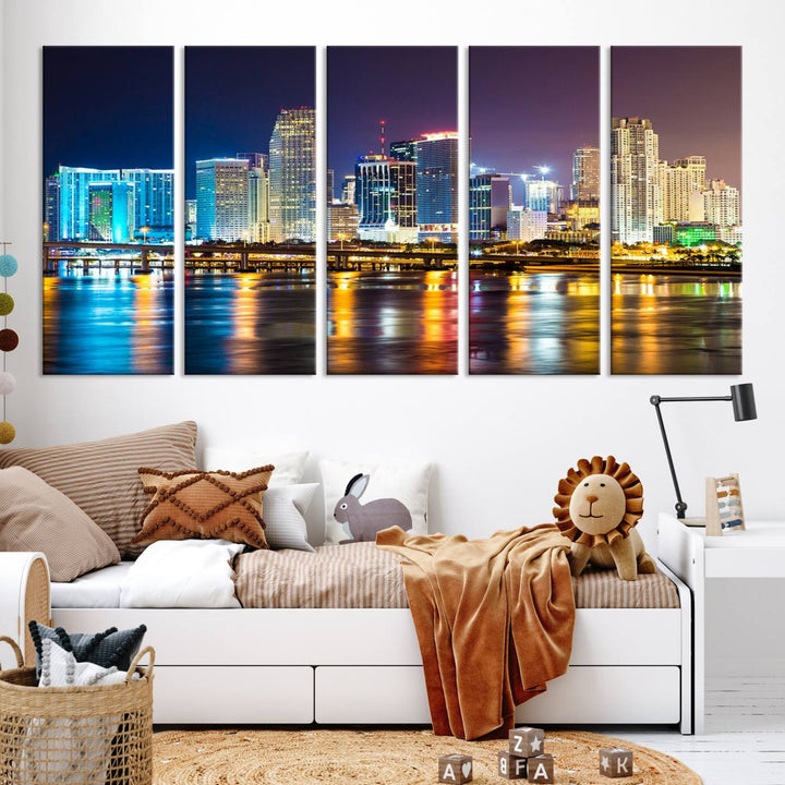 The Wall Art MIAMI Canvas Print features a stunning triptych of a city skyline at night, with vibrant lights reflecting on the water. This gallery-wrapped piece on museum-quality canvas delivers an exquisite finish.