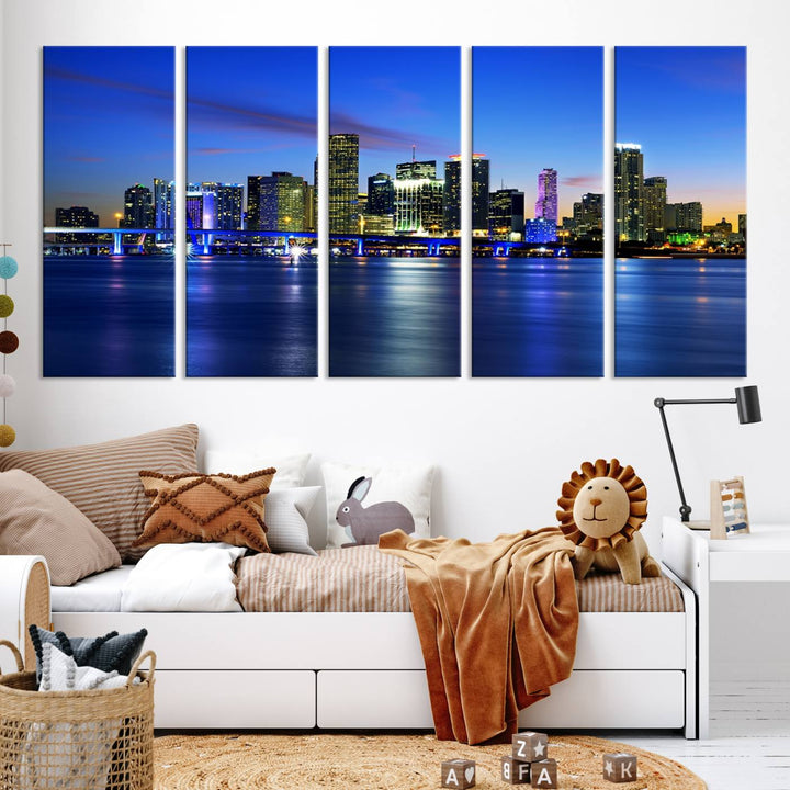 The modern living room showcases a striking Miami Blue Night Wall Art canvas print on the wall. The artwork is gallery wrapped on museum-quality canvas, ensuring durability and elegance.