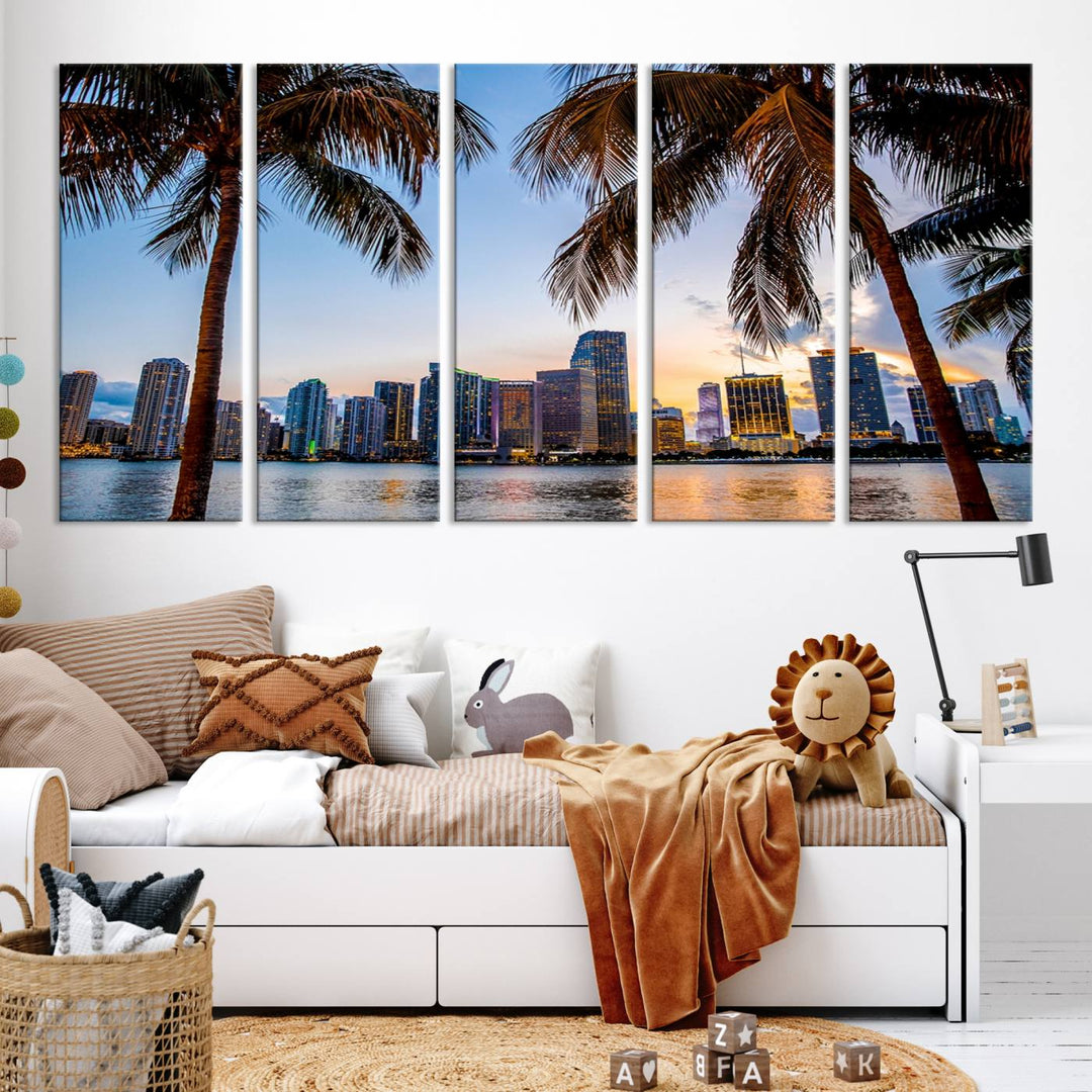 The Wall Art MIAMI Canvas Print features a triptych design depicting palm trees and a city skyline at sunset.