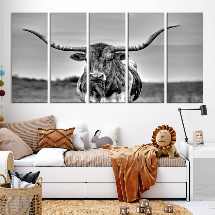 The Texas Longhorn Cow Wall Art, featuring a black and white image of a longhorn bull on canvas, brings charm to the room with its sophisticated appeal.